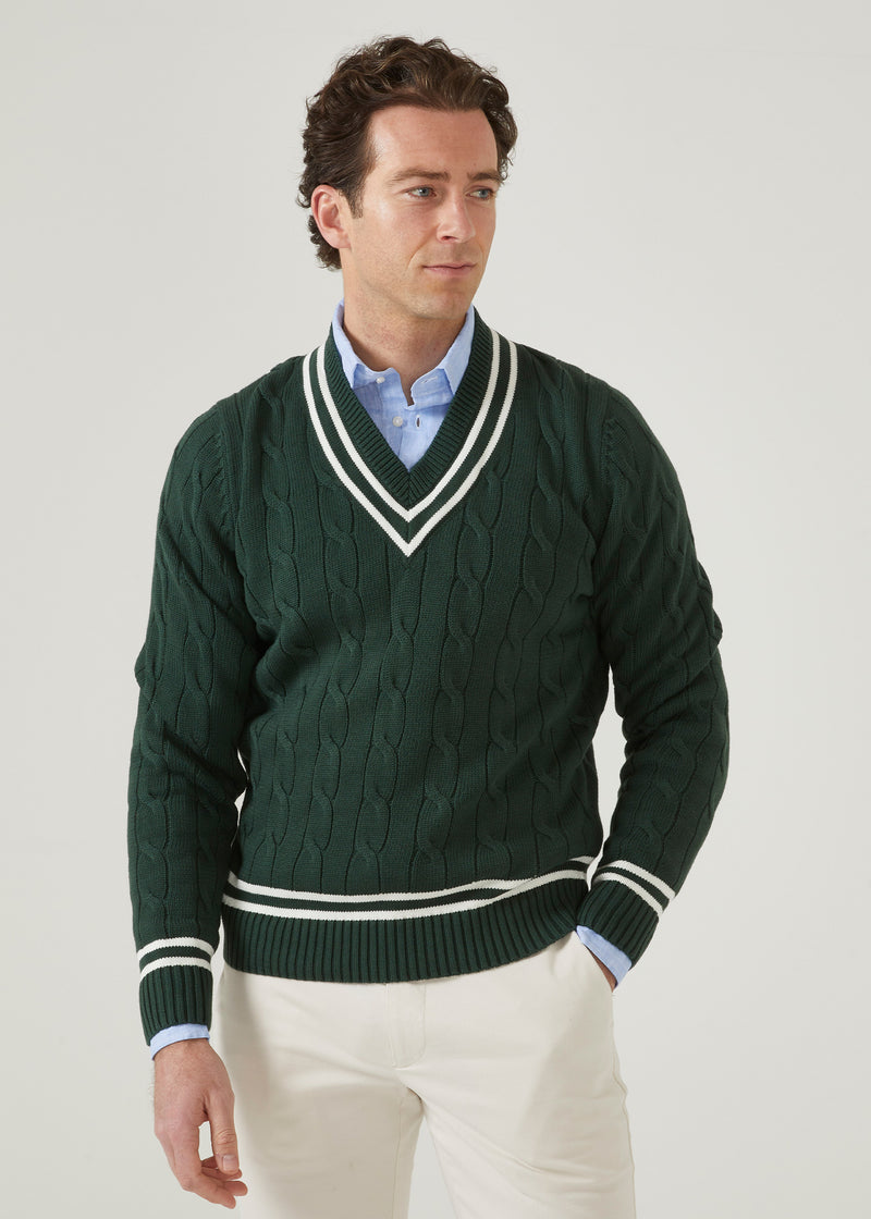Men's racing green cricket jumper with a vee neck and ecru trim.