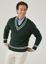 Men's racing green cricket jumper with a vee neck and ecru trim.