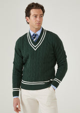 Men's racing green cricket jumper with a vee neck and ecru trim.