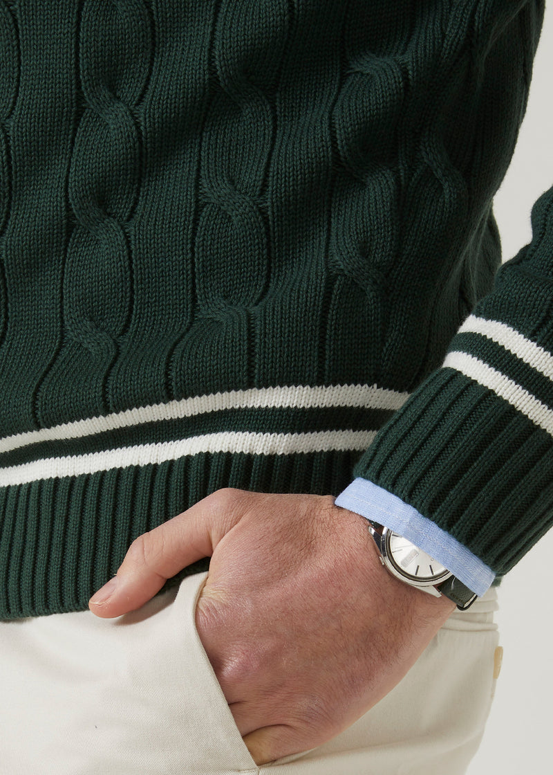 Men's racing green cricket jumper with a vee neck and ecru trim.